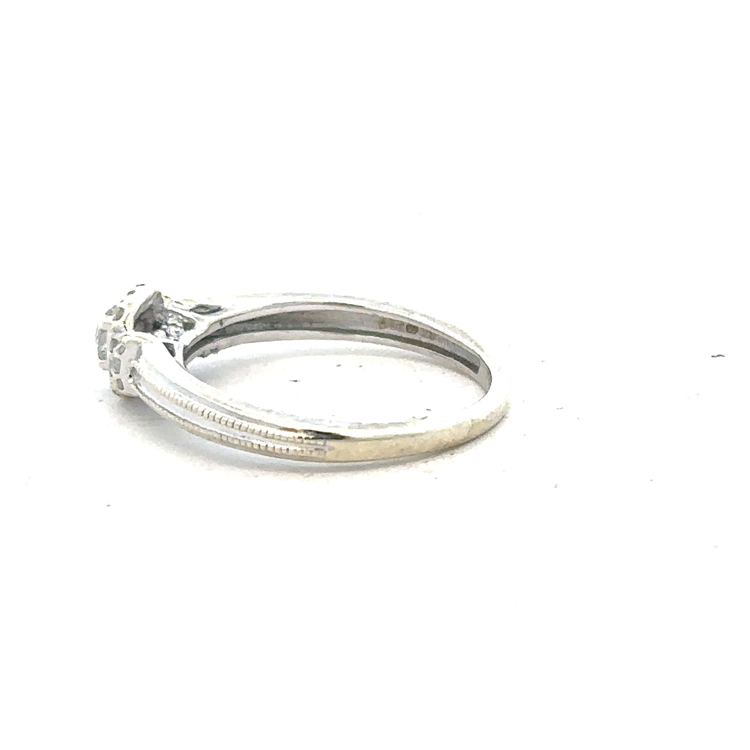 9ct white gold diamond ring with 20pts of diamonds in size K1/2, featuring a sleek band and sparkling gemstone detail.