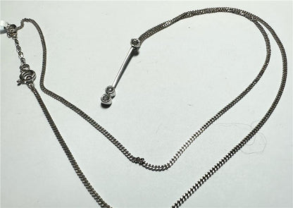 9ct white gold chain with 18ct white gold diamond pendant, featuring a sparkling diamond and elegant design.