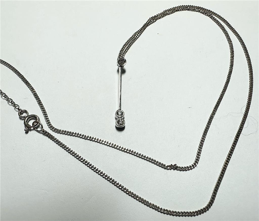 9ct white gold chain with 18ct white gold diamond pendant, weight 3.5g, showcasing elegant jewelry design and sparkling diamonds.