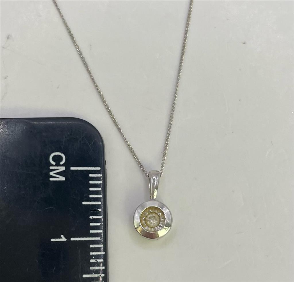 9ct white gold chain with pendant, featuring a sleek design and polished finish, unbranded jewelry accessory with elegant style.