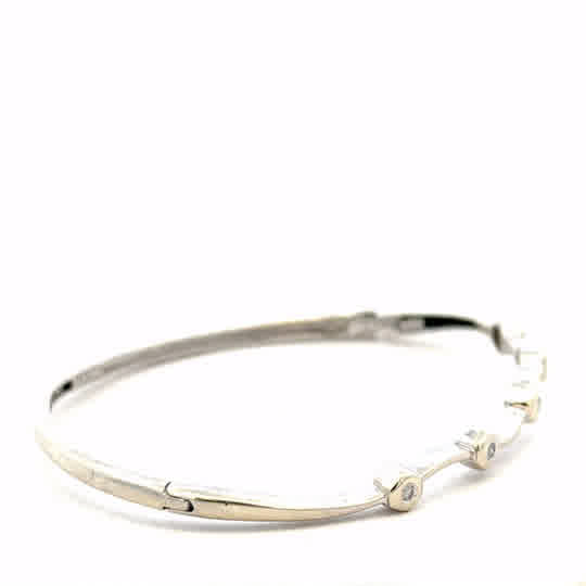 9ct white gold diamond bracelet featuring sparkling diamonds, weighing 7.7g, designed as a luxurious and elegant jewelry piece.