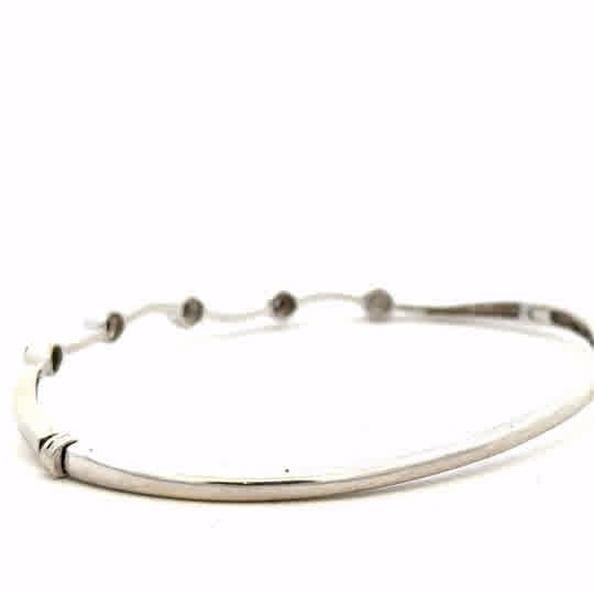 9ct white gold diamond bracelet with delicate design, showcasing sparkling diamonds and elegant craftsmanship.