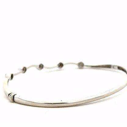 9ct white gold diamond bracelet with delicate design, showcasing sparkling diamonds and elegant craftsmanship.