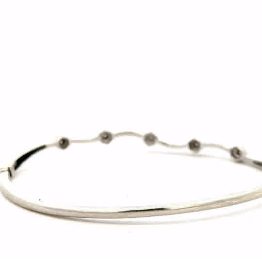 9ct white gold diamond bangle bracelet with sparkling diamonds, unbranded, weighing 7.7 grams, elegant jewelry accessory.