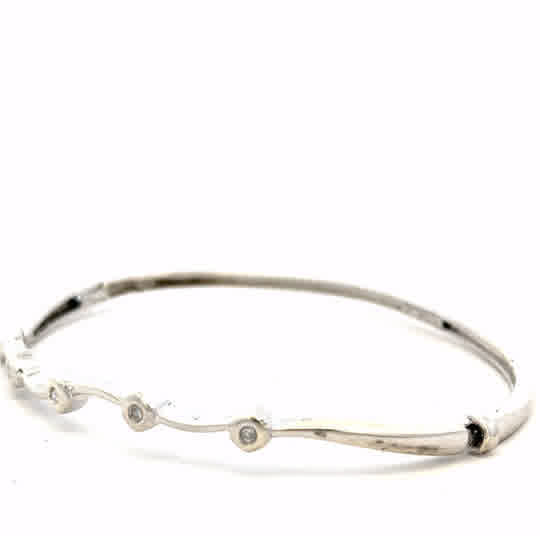 9ct white gold diamond bracelet with intricate design, showcasing sparkling diamonds and a polished finish.