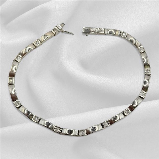 9ct white gold diamond bracelet with delicate design, 8 inches long, showcasing sparkling diamonds and fine craftsmanship.