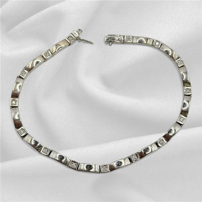 9ct white gold diamond bracelet with delicate design, 8 inches long, showcasing sparkling diamonds and fine craftsmanship.