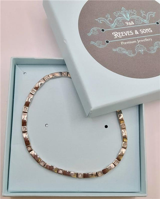 9ct white gold diamond bracelet, 8 inches long with sparkling diamonds, unbranded jewelry accessory on a plain background.
