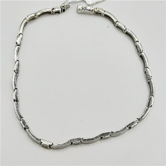 9ct white gold diamond bracelet with sparkling diamonds, 8 inches long, showcasing elegant jewelry design and craftsmanship.