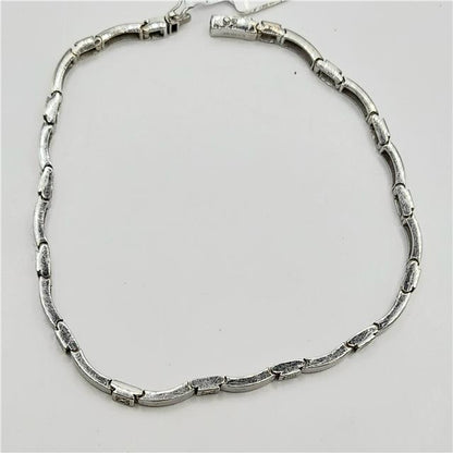 9ct white gold diamond bracelet with sparkling diamonds, 8 inches long, showcasing elegant jewelry design and craftsmanship.