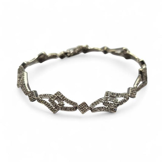 9ct white gold diamond bracelet with sparkling diamonds, featuring a delicate chain and elegant design.