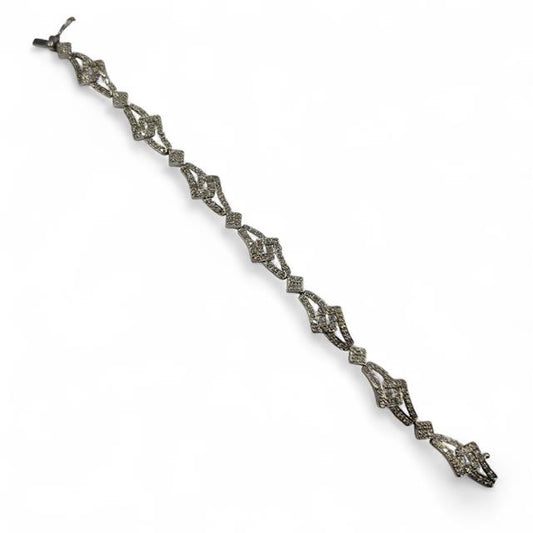 9ct white gold diamond bracelet featuring sparkling diamonds and a delicate chain design.