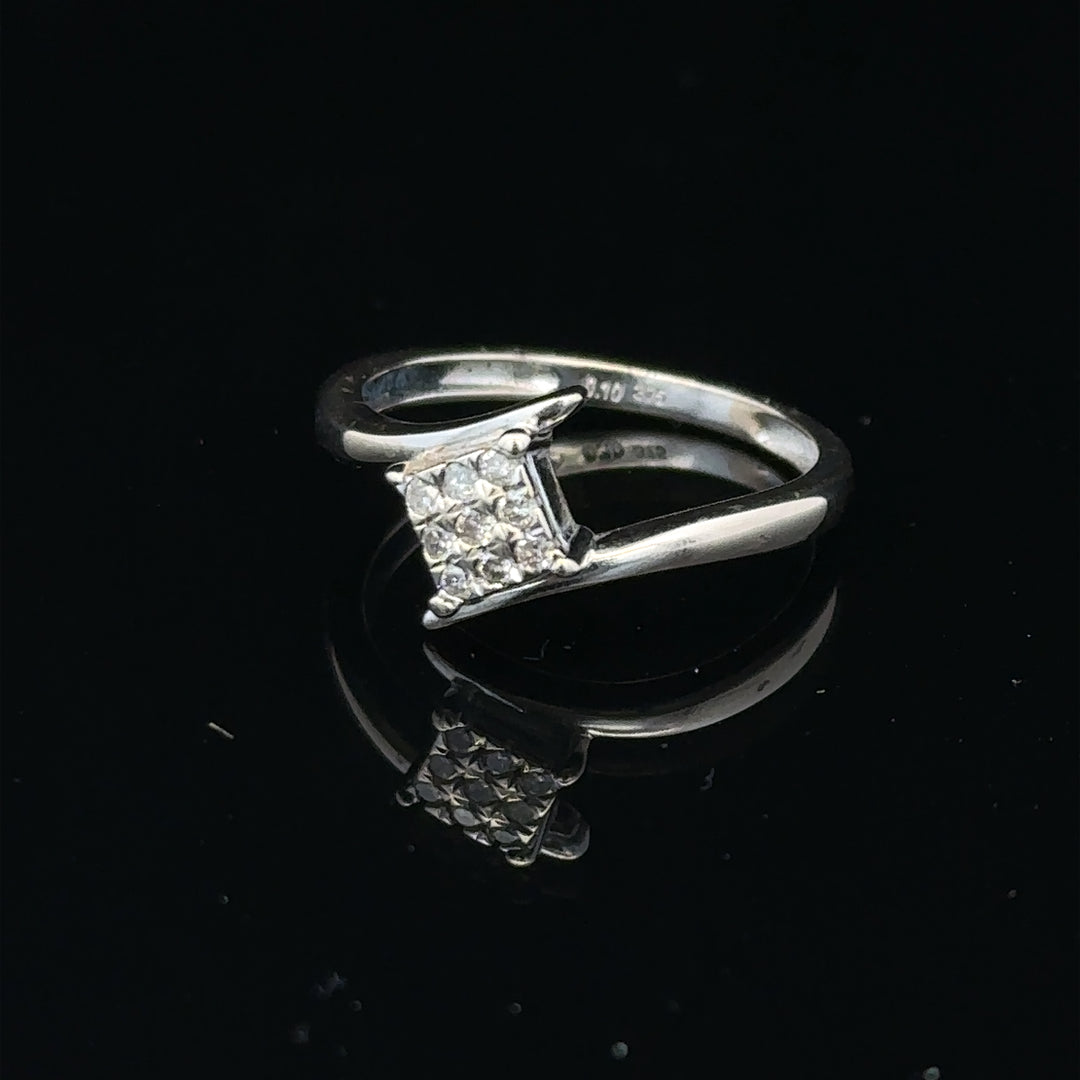 9ct white gold diamond cluster ring featuring a 10-point diamond, showcasing a sparkling elegant design.