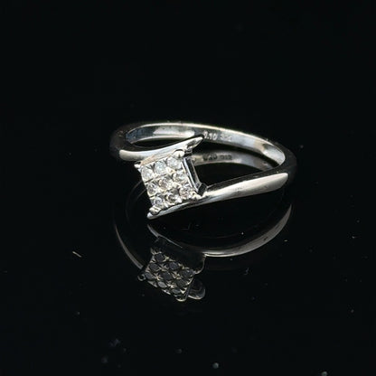 9ct white gold diamond cluster ring featuring a 10-point diamond, showcasing a sparkling elegant design.