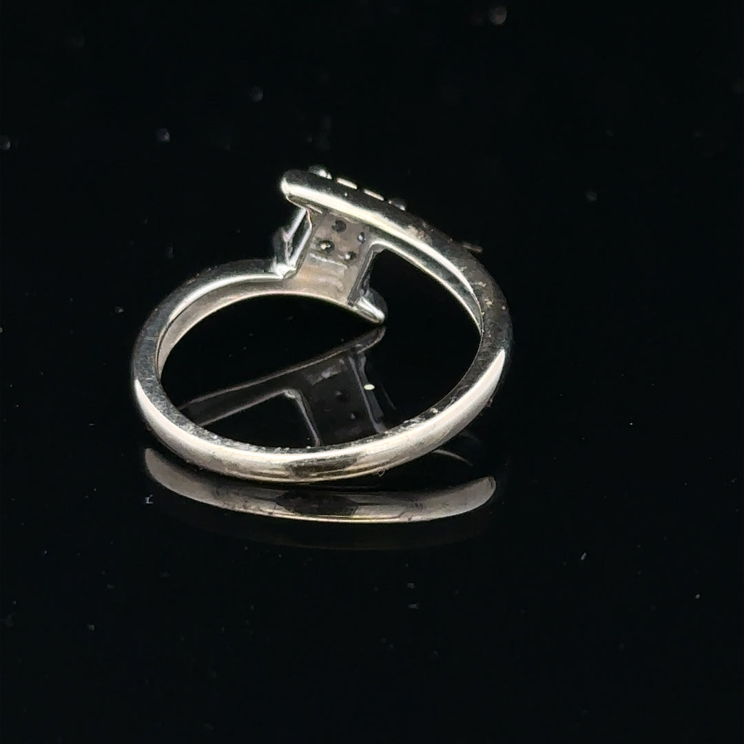 9ct white gold diamond cluster ring with a 10-point diamond, showcasing sparkling brilliance and elegant design.