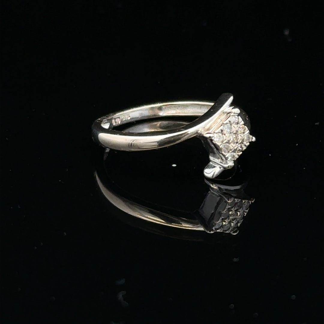 9ct white gold diamond cluster ring with 10-point sparkling diamond, showcasing its elegant design and fine craftsmanship.