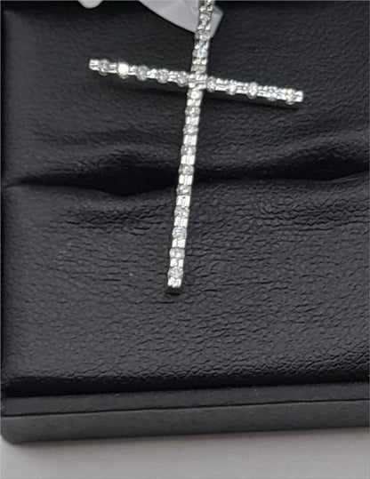 9ct white gold diamond cross pendant with sparkling diamonds, weighs 2.1g, featuring a detailed cross design.