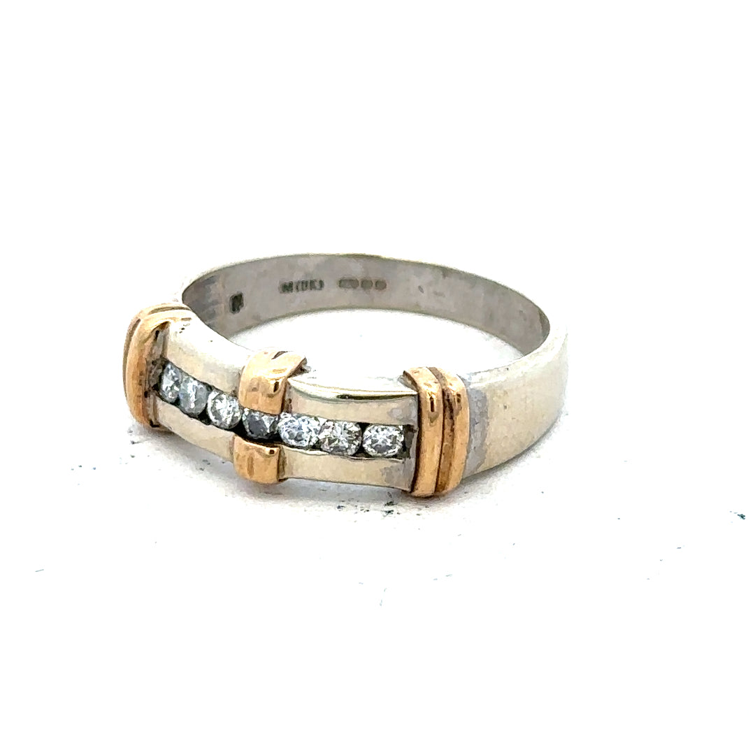 9ct white gold diamond ring with a central sparkling diamond and elegant band, showcasing fine craftsmanship and luxury style.