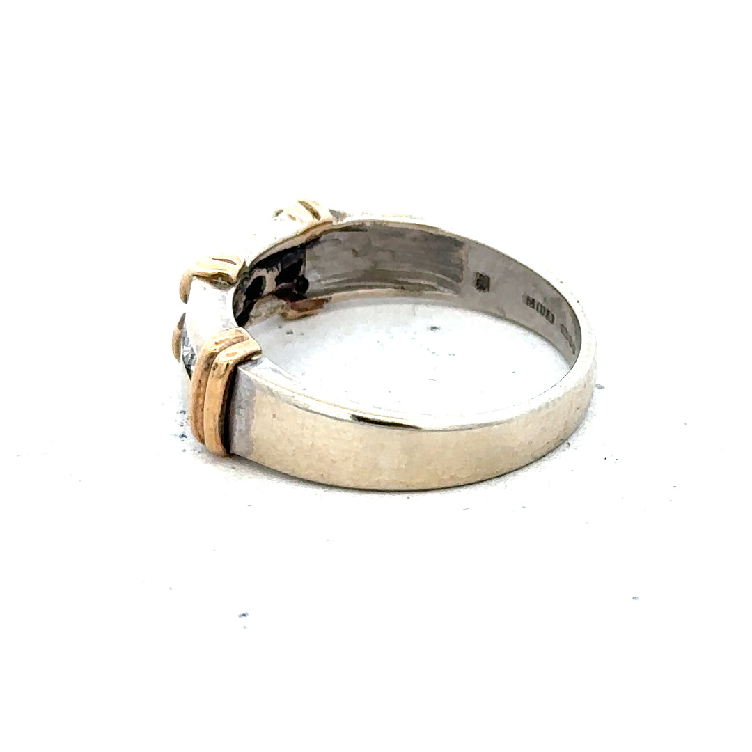 9ct white gold diamond ring showing a sleek band with a sparkling diamond centerpiece, elegant and sophisticated jewelry piece.