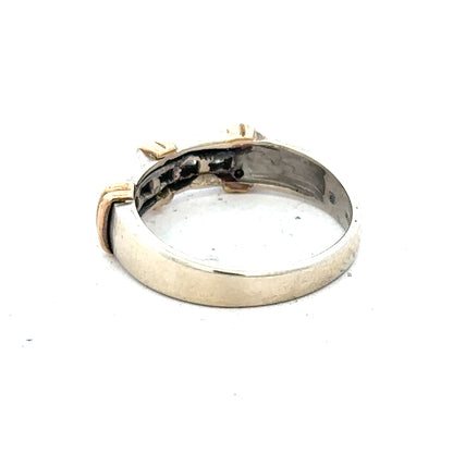 9ct white gold diamond ring with a central sparkling diamond, showcasing elegant craftsmanship and a sleek, modern design.