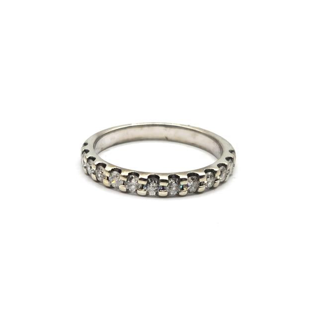 9ct white gold diamond ring with a central diamond setting, showcasing a sleek and elegant design.