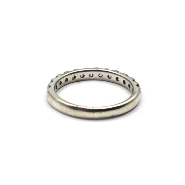 9ct white gold diamond ring with a central round-cut diamond, showcasing elegant craftsmanship and sparkling gemstones.