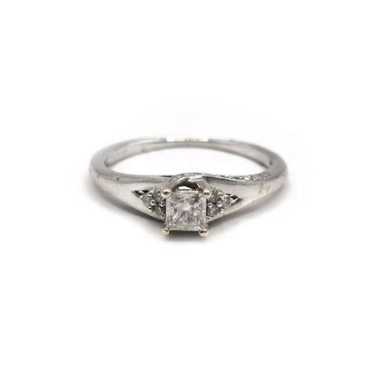 9ct white gold diamond ring with a sparkling central diamond and delicate band, showcasing elegant jewelry craftsmanship.