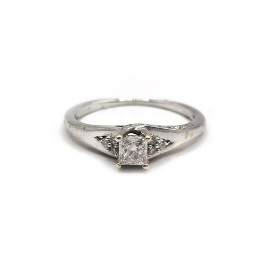 9ct white gold diamond ring with a sparkling central diamond and delicate band, showcasing elegant jewelry craftsmanship.