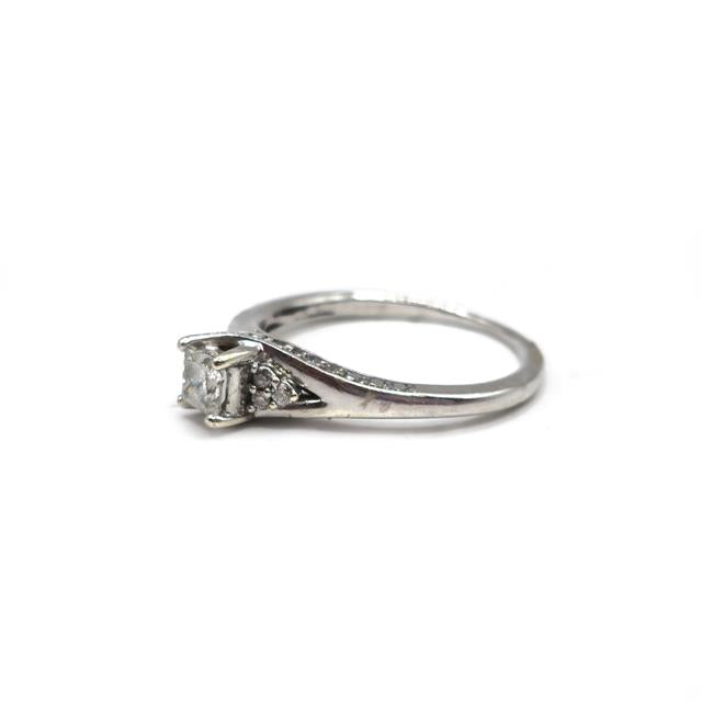 9ct white gold diamond ring with sparkling diamonds, showcasing elegant craftsmanship and a classic design.