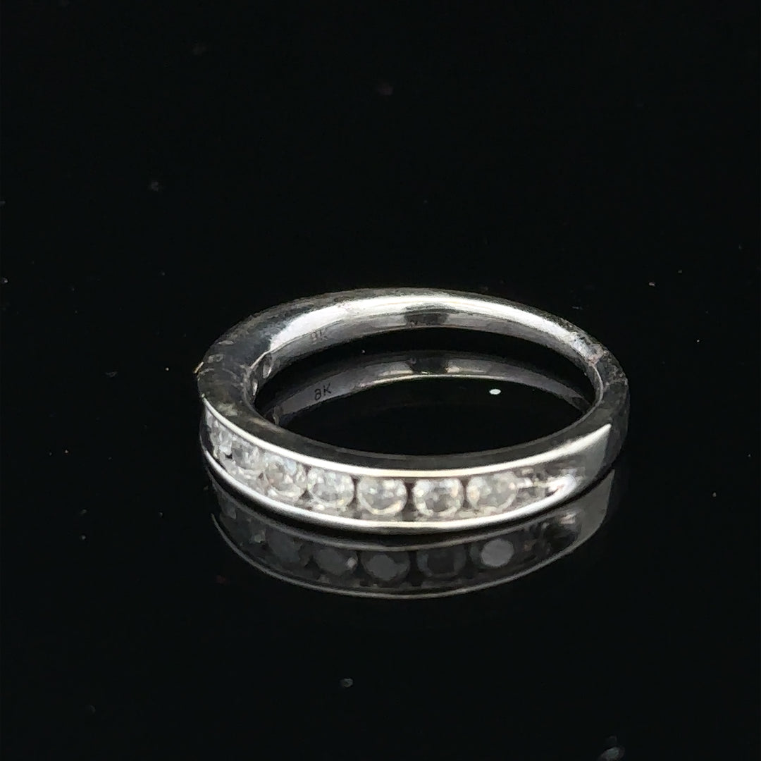 9ct white gold diamond ring in size J with sparkling diamonds, showcasing elegant jewelry design.
