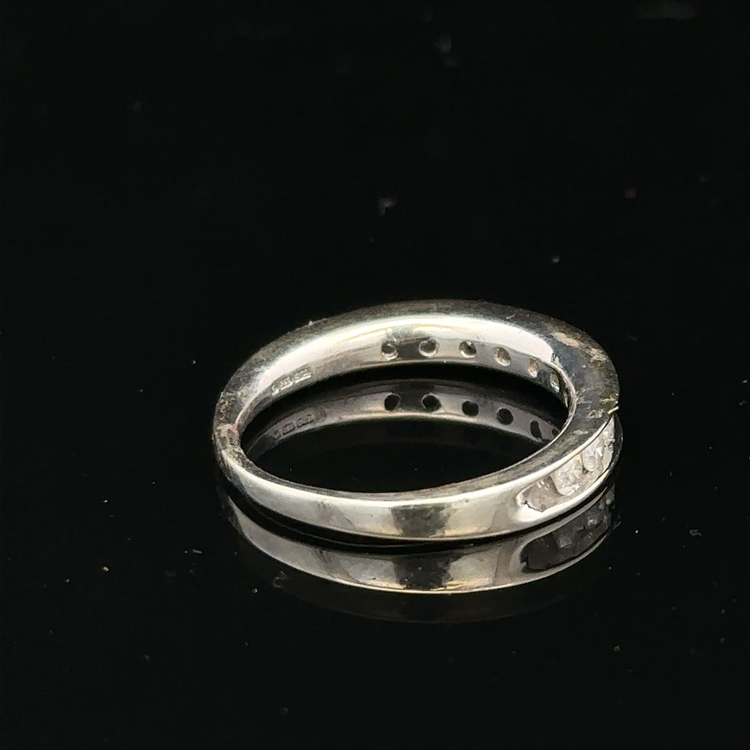 9ct white gold diamond ring in size J with a sparkling central diamond and elegant band design.