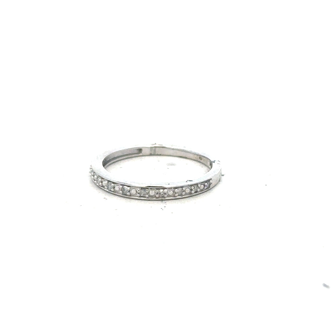 9ct white gold diamond ring in size J1/2, featuring a sparkling diamond setting, unbranded jewelry accessory.