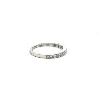 9ct white gold diamond ring size J1/2 with sparkling stones, showcasing elegant craftsmanship and a sleek band design.