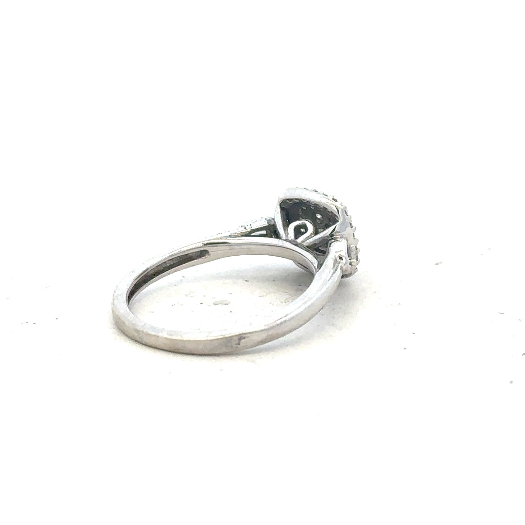 9ct white gold diamond ring in size K featuring a sparkling central diamond and elegant band design.