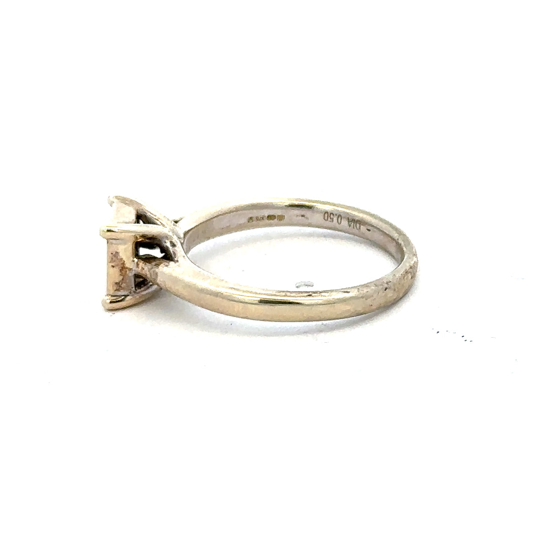 9ct white gold diamond ring in size L1/2, featuring a sparkling diamond set on a sleek band.