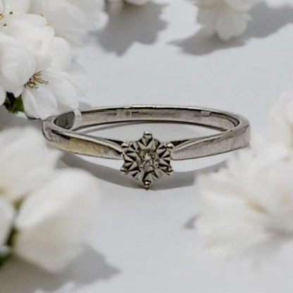 9ct white gold diamond ring in size N featuring a sparkling central diamond and elegant band design.