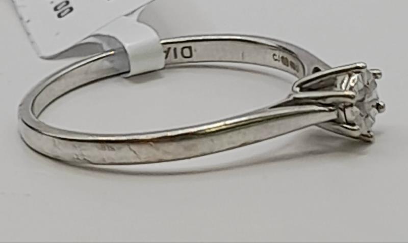 9ct white gold diamond ring in size N featuring sparkling diamonds, unbranded jewelry piece with elegant design.