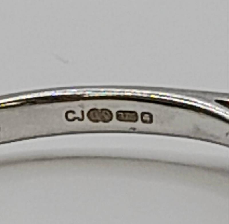 9ct white gold diamond ring in size N featuring sparkling diamonds and a sleek design. Unbranded jewelry showcasing elegance.