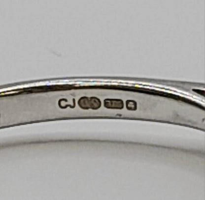 9ct white gold diamond ring in size N featuring sparkling diamonds and a sleek design. Unbranded jewelry showcasing elegance.