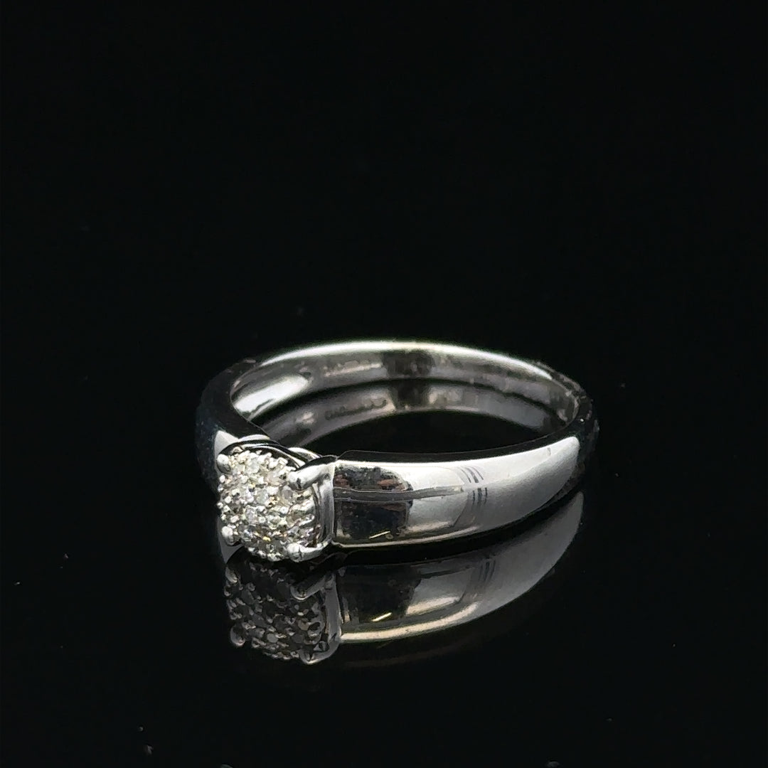 9ct white gold diamond ring, size N1/2, with a sparkling diamond centerpiece and elegant band design.