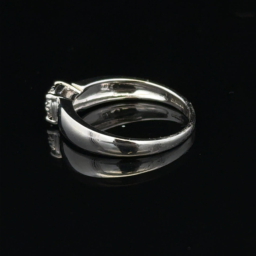 9ct white gold diamond ring in size N1/2, featuring a sparkling diamond set in a sleek band.
