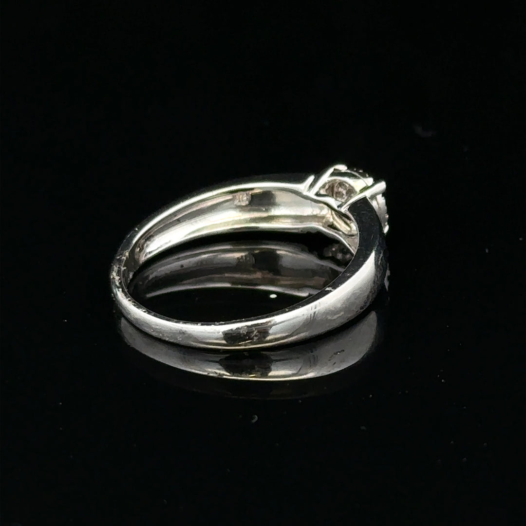 9ct white gold diamond ring in size N1/2, featuring a sparkling central diamond and elegant band design.
