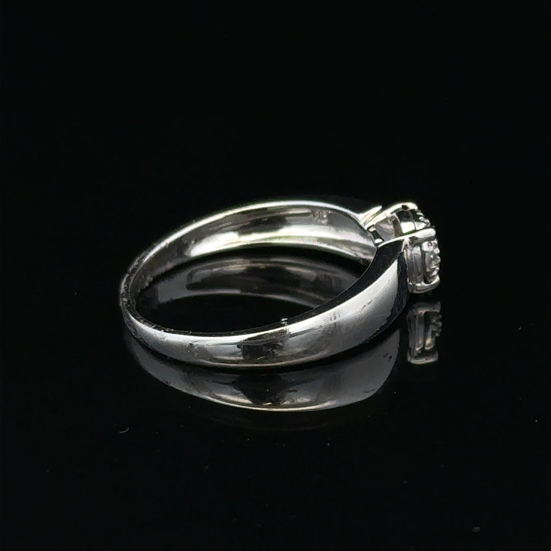 9ct white gold diamond ring in size N1/2 with sparkling diamonds, showcasing elegant jewelry craftsmanship.