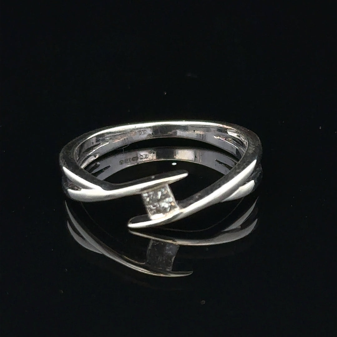 9ct white gold diamond ring in size O with sparkling diamonds, showcasing elegant craftsmanship and a sleek design.