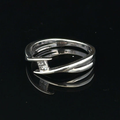9ct white gold diamond ring in size O with a sparkling central diamond, showcasing elegant jewelry craftsmanship.