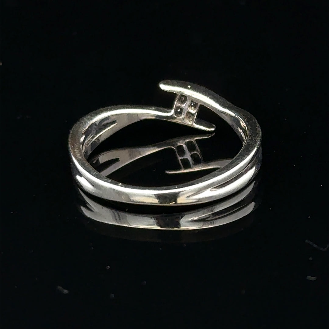9ct white gold diamond ring in size O with a sparkling diamond, showcasing elegant jewelry craftsmanship.