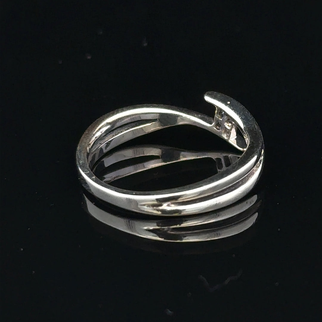 9ct white gold diamond ring in size O with a sparkling central diamond, elegant jewelry piece without branding.