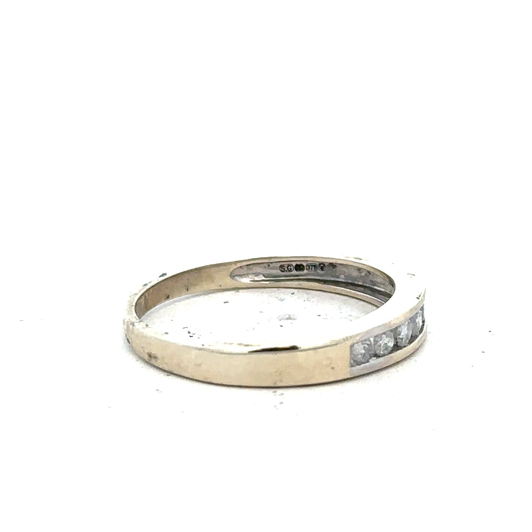 9ct white gold diamond ring in size Q with a sparkling central diamond and delicate band, unbranded jewelry piece.