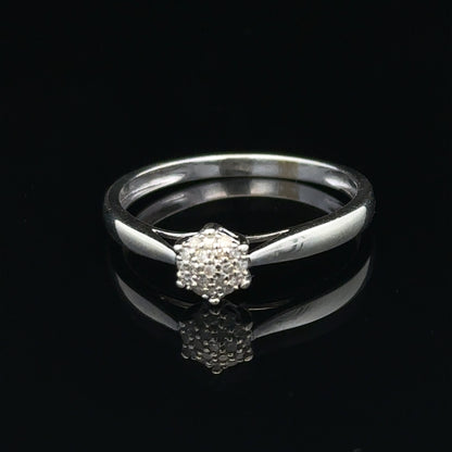 9ct white gold diamond ring in size R1/2 featuring a sparkling diamond accent, elegant jewelry piece.