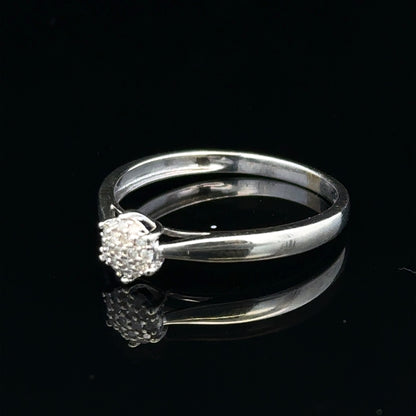 9ct white gold diamond ring in size R1/2 featuring a sparkling central diamond and a sleek, elegant band.